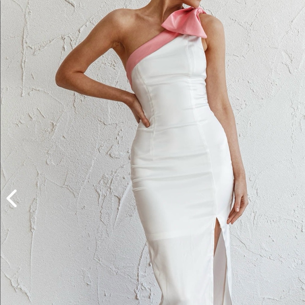 White satin dress with pink bow